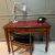 Antique Mahogany Writing Desk: Red Leather Top, Brass Castors